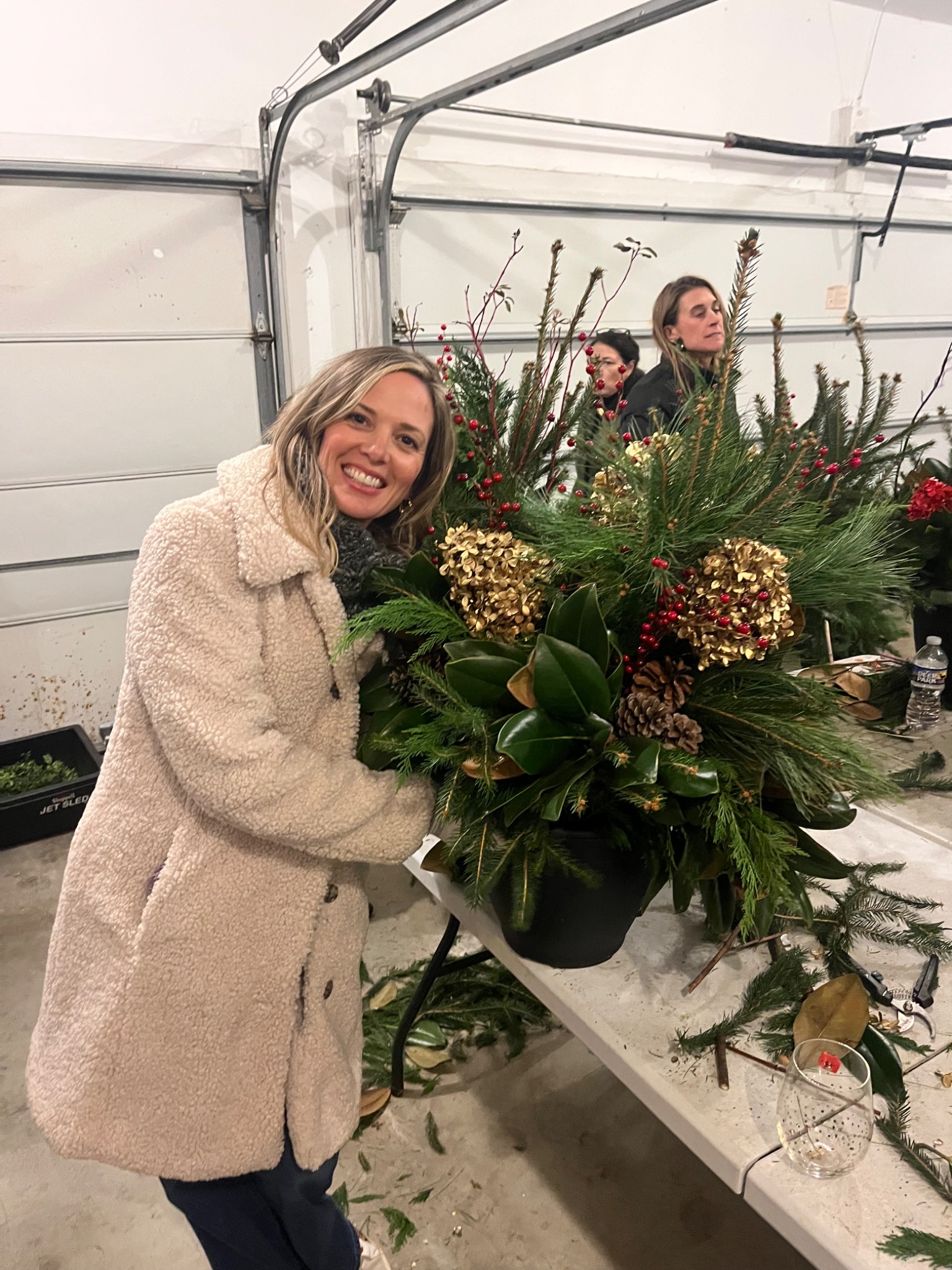 Guest posing beside a finished holiday container
