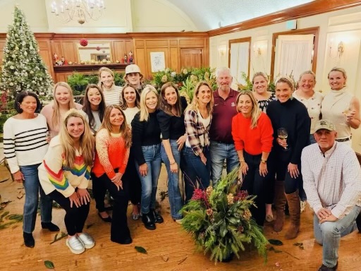Workshop guests gathered with their finished evergreen arrangements